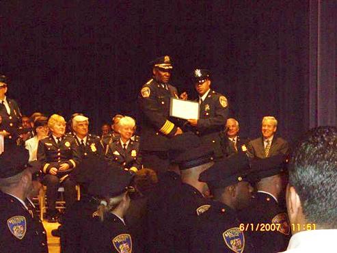 Officer Joseph Rosado accepting his certificate